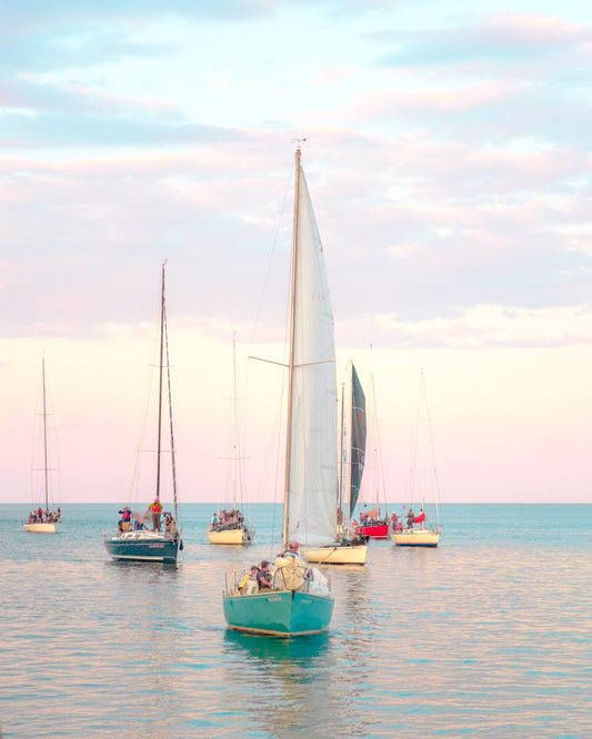 Sailboats return to the harbor
